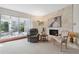 Cozy living room with fireplace and patio access at 3942 Trophy Blvd, New Port Richey, FL 34655