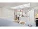 Galley kitchen with white cabinets and breakfast area at 3942 Trophy Blvd, New Port Richey, FL 34655