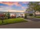 Condo exterior at sunset with carport and landscaping at 3942 Trophy Blvd, New Port Richey, FL 34655