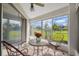 Bright sunroom with sliding doors and view of backyard at 3942 Trophy Blvd, New Port Richey, FL 34655