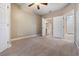 Bright bedroom with carpet and en-suite bathroom access at 4323 Bayside Village Dr # 105, Tampa, FL 33615