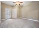 Spacious bedroom with neutral carpeting and patio access at 4323 Bayside Village Dr # 105, Tampa, FL 33615