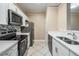 Modern kitchen with white cabinets, stainless steel appliances, and quartz countertops at 4323 Bayside Village Dr # 105, Tampa, FL 33615