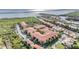 Aerial view of a waterfront community with multiple buildings and lush landscaping at 4323 Bayside Village Dr # 105, Tampa, FL 33615