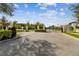 The Hidden Reserve gated community entrance ensures privacy with an elegant iron gate and manicured landscaping at 101 Brookover Ln, Brandon, FL 33511