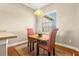 Small breakfast nook with table and two red and white striped chairs at 10527 Old Tampa Bay Dr, San Antonio, FL 33576