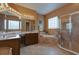 Bathroom boasts double vanity, soaking tub, and walk-in shower at 20103 Shady Hill Ln, Tampa, FL 33647
