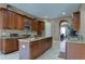 Large kitchen with center island, granite counters, and ample cabinetry at 20103 Shady Hill Ln, Tampa, FL 33647