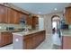 Large kitchen with center island, granite counters, and ample cabinetry at 20103 Shady Hill Ln, Tampa, FL 33647