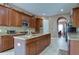 Large kitchen with center island, granite counters, and ample cabinetry at 20103 Shady Hill Ln, Tampa, FL 33647