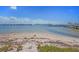 Scenic waterfront view with a sandy beach and boats at 3120 Beach S Blvd # 7, Gulfport, FL 33707