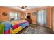 Relaxing bedroom with a ceiling fan and colorful decor at 3120 Beach S Blvd # 7, Gulfport, FL 33707