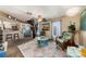 Living room with spiral staircase and stone floors at 3120 Beach S Blvd # 7, Gulfport, FL 33707