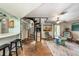 Living room with spiral staircase and stone floors at 3120 Beach S Blvd # 7, Gulfport, FL 33707