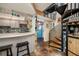 Open floor plan with kitchen, entryway and spiral staircase at 3120 Beach S Blvd # 7, Gulfport, FL 33707