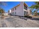 Building exterior with parking and landscaping at 3120 Beach S Blvd # 7, Gulfport, FL 33707