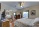 Bedroom with mirrored closet and ceiling fan at 420 49Th E St # 153, Palmetto, FL 34221