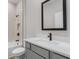 Well-lit bathroom featuring a modern vanity and a sleek shower with neutral tile at 5479 Brussels Ter, Port Charlotte, FL 33981