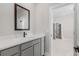 Bathroom features a single vanity with quartz countertops and modern fixtures at 5479 Brussels Ter, Port Charlotte, FL 33981