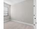 Bright, carpeted bedroom with natural light entering through the window at 5479 Brussels Ter, Port Charlotte, FL 33981