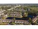 Aerial view of townhome community by a lake at 6212 Bayside Key Dr, Tampa, FL 33615