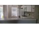 Kitchen features white appliances and cabinets at 6212 Bayside Key Dr, Tampa, FL 33615
