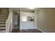Living room with wood-look floors and kitchen view at 6212 Bayside Key Dr, Tampa, FL 33615