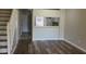 Living room with wood-look floors and kitchen view at 6212 Bayside Key Dr, Tampa, FL 33615