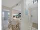 Bright kitchen features white cabinets, quartz countertops, and breakfast bar at 6372 Palma Del Mar S Blvd # 320, St Petersburg, FL 33715