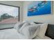 Bedroom with light and airy feel and nautical-themed artwork at 6372 Palma Del Mar S Blvd # 320, St Petersburg, FL 33715