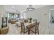 Bright dining area with wooden table and four chairs at 6372 Palma Del Mar S Blvd # 320, St Petersburg, FL 33715