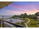 Community pool and waterfront view at sunset at 6372 Palma Del Mar S Blvd # 320, St Petersburg, FL 33715