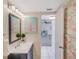 Clean bathroom with updated vanity and flamingo decor at 6372 Palma Del Mar S Blvd # 320, St Petersburg, FL 33715