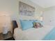 Bedroom with light blue bedding and coastal artwork at 6372 Palma Del Mar S Blvd # 320, St Petersburg, FL 33715