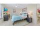 Main bedroom with king-size bed and ceiling fan at 6372 Palma Del Mar S Blvd # 320, St Petersburg, FL 33715