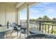 Relaxing balcony with wicker furniture and scenic water views at 6372 Palma Del Mar S Blvd # 320, St Petersburg, FL 33715