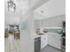 Modern kitchen with white cabinets, stainless steel appliances, and quartz countertops at 6372 Palma Del Mar S Blvd # 320, St Petersburg, FL 33715