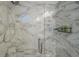 Walk-in shower with marble tile and glass enclosure at 6372 Palma Del Mar S Blvd # 320, St Petersburg, FL 33715