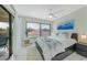 Spacious bedroom with a king-size bed and water views at 6372 Palma Del Mar S Blvd # 320, St Petersburg, FL 33715