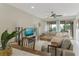 Spacious living room with sectional sofa, fireplace, and access to balcony at 6372 Palma Del Mar S Blvd # 320, St Petersburg, FL 33715