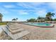 Spacious pool deck with numerous lounge chairs for relaxing by the pool at 6372 Palma Del Mar S Blvd # 320, St Petersburg, FL 33715