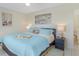 Spacious main bedroom with light blue bedding and a tray with morning coffee at 6372 Palma Del Mar S Blvd # 320, St Petersburg, FL 33715