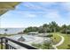 Inviting pool area with bay views, lush landscaping, and relaxing patio furniture at 6372 Palma Del Mar S Blvd # 320, St Petersburg, FL 33715