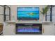 Modern electric fireplace built into a white entertainment center at 6372 Palma Del Mar S Blvd # 320, St Petersburg, FL 33715