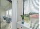 Bright bedroom with water views and access to a private balcony at 6372 Palma Del Mar S Blvd # 320, St Petersburg, FL 33715