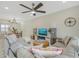 Bright living room with comfy sectional sofa, large TV, and stylish coffee table at 6372 Palma Del Mar S Blvd # 320, St Petersburg, FL 33715