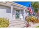 Modern front door entrance with stone steps and landscaping at 827 Placido Ne Way, St Petersburg, FL 33704