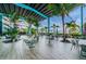 Outdoor patio area with tables, chairs, and umbrellas overlooking marina at 4354 50Th S Ter, St Petersburg, FL 33711