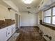 A room with damaged walls and floors requiring complete renovation at 4354 50Th S Ter, St Petersburg, FL 33711