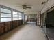 Sunroom with sliding glass doors and exposed framing, needs renovation at 4354 50Th S Ter, St Petersburg, FL 33711